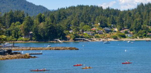 Kayakers and boats in the waters surrounding Bowen Island, BC